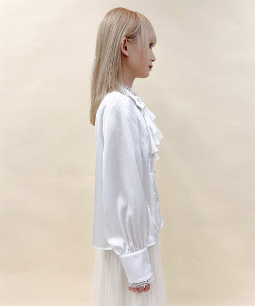 Blouse with jabot brooch