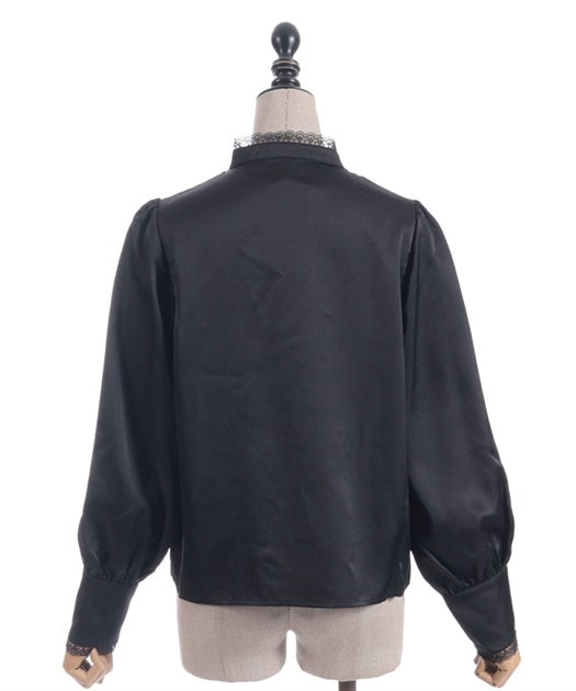 Blouse with jabot brooch