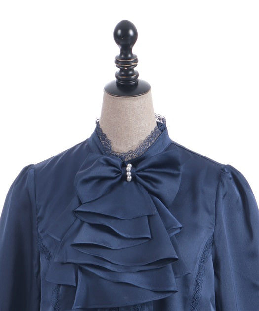 Blouse with jabot brooch